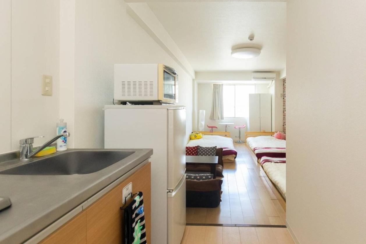 Apartamento ゲストハウス大国町駅前 *